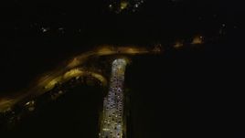 5K aerial stock footage of heavy traffic exiting the Yerba Buena Tunnel, Bay Bridge, San Francisco, California, night Aerial Stock Footage | AXSF07_030