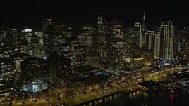 5K aerial stock footage of tilting from the bay, revealing skyscrapers in Downtown San Francisco, California, night Aerial Stock Footage | AXSF07_033