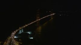 5K aerial stock footage tilt from bird's eye of freeway interchange to reveal Golden Gate Bridge, San Francisco, California, night Aerial Stock Footage | AXSF07_038