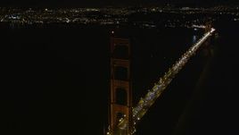 5K aerial stock footage tilt from light traffic to tower of Golden Gate Bridge, San Francisco, California, night Aerial Stock Footage | AXSF07_041