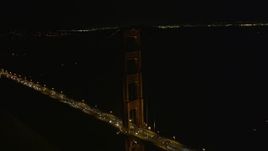 5K aerial stock footage of circling tower on famous Golden Gate Bridge, San Francisco, California, night Aerial Stock Footage | AXSF07_043