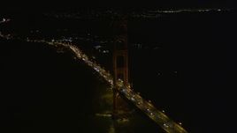 5K aerial stock footage approach and orbit light traffic on the Golden Gate Bridge, San Francisco, California, night Aerial Stock Footage | AXSF07_044