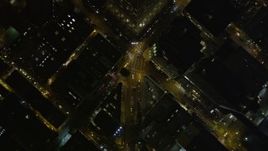 5K aerial stock footage bird's eye view of Columbus Avenue through North Beach, reveal Transamerica Pyramid and Downtown San Francisco, California, night Aerial Stock Footage | AXSF07_067