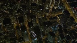 5K aerial stock footage tilt to bird's eye view of downtown skyscrapers around Market Street, San Francisco, California, night Aerial Stock Footage | AXSF07_077