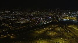 5K aerial stock footage tilt from Port of Oakland to reveal I-880 and Downtown Oakland, California, night Aerial Stock Footage | AXSF07_088