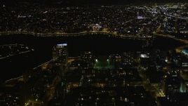 5K aerial stock footage flying over high-rises toward Lake Merritt, Downtown Oakland, California, night Aerial Stock Footage | AXSF07_091