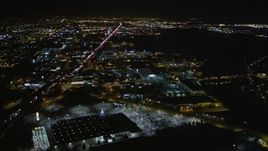 5K aerial stock footage of flying over I-880 freeway and warehouses, Oakland, California, night Aerial Stock Footage | AXSF07_097