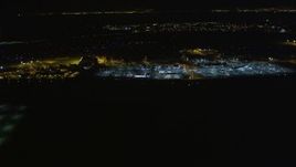 5K aerial stock footage of flying by Oakland International Airport, Oakland, California, night Aerial Stock Footage | AXSF07_099