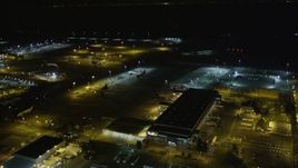 5K aerial stock footage fly by FedEx terminal, Oakland International Airport, Oakland, California, night Aerial Stock Footage | AXSF07_101