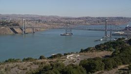 5K aerial stock footage of flying over hill, revealing Carquinez Bridge, Carquinez Strait, Vallejo, California Aerial Stock Footage | AXSF08_025