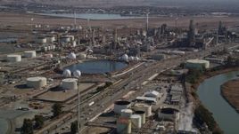 5K aerial stock footage of flying by oil refinery buildings at Tesoro Golden Eagle Refinery, Pacheco, California Aerial Stock Footage | AXSF08_055