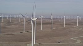 5K aerial stock footage of flying by windmills at Shiloh Wind Power Plant, Montezuma Hills, California Aerial Stock Footage | AXSF08_069
