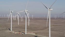 5K aerial stock footage of flying by rows of windmills, Shiloh Wind Power Plant, Montezuma Hills, California Aerial Stock Footage | AXSF08_073