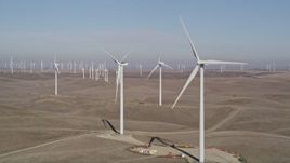 5K aerial stock footage flyby windmills while zooming out at Shiloh Wind Power Plant, Montezuma Hills, California Aerial Stock Footage | AXSF08_078