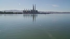 5K aerial stock footage tilt up from water, revealing Pittsburg power plant and smoke stacks, Pittsburg, California Aerial Stock Footage | AXSF08_083