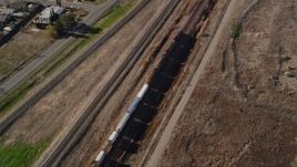 5K aerial stock footage of tracking a train moving past residential neighborhoods, fields, Pittsburg, California Aerial Stock Footage | AXSF08_090