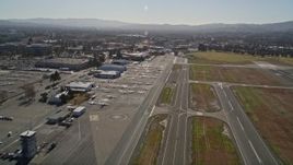 5K aerial stock footage video approach parked airplanes at Buchanan Field Airport, Concord, California Aerial Stock Footage | AXSF08_095