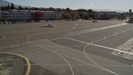 5K aerial stock footage of passing hangars at Buchanan Field Airport, orbit red plane in Concord, California Aerial Stock Footage | AXSF08_096