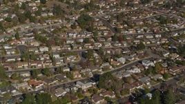 5K aerial stock footage of a reverse view of tract homes in residential neighborhoods, Martinez, California Aerial Stock Footage | AXSF09_005