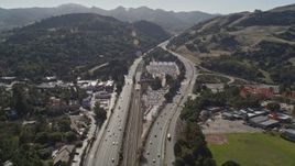 5K aerial stock footage fly over Highway 24 freeway, flyby a BART station and parking lots, Orinda, California Aerial Stock Footage | AXSF09_009
