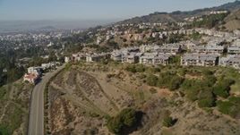 5K aerial stock footage of flying by hilltop apartment buildings, Oakland Hills, California Aerial Stock Footage | AXSF09_013