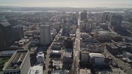 5K aerial stock footage of following Broadway and tilt to wider view of office buildings, Downtown Oakland, California Aerial Stock Footage | AXSF09_018
