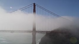 5K aerial stock footage of approaching and flying by the Golden Gate Bridge wrapped in fog, San Francisco, California Aerial Stock Footage | AXSF09_026