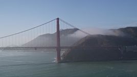 5K aerial stock footage of flying by the Golden Gate Bridge, light fog, San Francisco, California Aerial Stock Footage | AXSF09_045