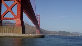 5K aerial stock footage of flying low over the Bay, under the Golden Gate Bridge, San Francisco, California Aerial Stock Footage | AXSF09_047