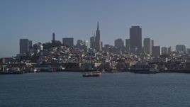 5K aerial stock footage of Fisherman's Wharf and city skyline seen from the bay, reveal Pier 39 and Coit Tower, Downtown San Francisco, California Aerial Stock Footage | AXSF09_053