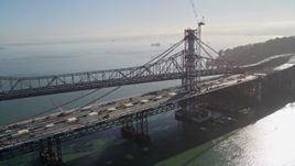 5K aerial stock footage of flying by the new spans under construction, Bay Bridge, San Francisco, California Aerial Stock Footage | AXSF09_063