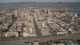 5K aerial stock footage of flying by 880 freeway and urban neighborhoods, revealing I- 980, Downtown Oakland, and Lake Merritt, California Aerial Stock Footage | AXSF09_069