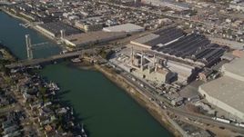 5K aerial stock footage of flying away from factories and warehouses in Oakland, Alameda, California Aerial Stock Footage | AXSF09_071