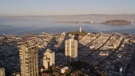 5K aerial stock footage of a view of Coit Tower while flying by Russian Hill high-rises, San Francisco, California, sunset Aerial Stock Footage | AXSF10_004