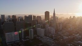 5K aerial stock footage of flying by downtown skyscrapers and Transamerica Pyramid, Downtown San Francisco, California at sunset Aerial Stock Footage | AXSF10_007