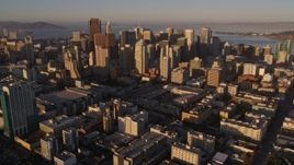 5K aerial stock footage tilt from I-80 to reveal and approach downtown skyscrapers, Downtown San Francisco, California, sunset Aerial Stock Footage | AXSF10_022