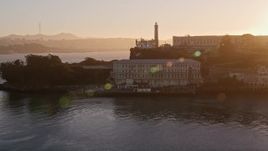 5K aerial stock footage circling low around the island of Alcatraz, San Francisco, California, sunset Aerial Stock Footage | AXSF10_028