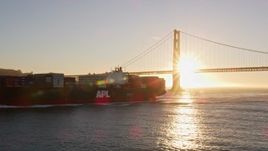 5K aerial stock footage low altitude flyby of a cargo ship near the Golden Gate Bridge, San Francisco, California, sunset Aerial Stock Footage | AXSF10_032