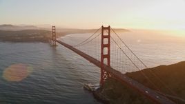 5K aerial stock footage of a reverse view of the Golden Gate Bridge and setting sun in San Francisco, California Aerial Stock Footage | AXSF10_040