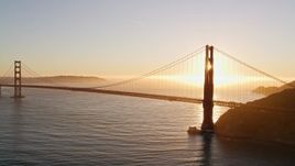 5K aerial stock footage fly past the setting sun behind the Golden Gate Bridge, San Francisco, California, sunset Aerial Stock Footage | AXSF10_041