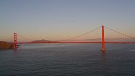 5K aerial stock footage of flying away from iconic Golden Gate Bridge in San Francisco, California, at sunset Aerial Stock Footage | AXSF10_044