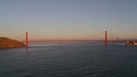 5K aerial stock footage flying away from Golden Gate Bridge, San Francisco, California, sunset Aerial Stock Footage | AXSF10_045