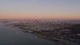 5K aerial stock footage of approaching the Downtown San Francisco skyline at sunset, California Aerial Stock Footage | AXSF10_054