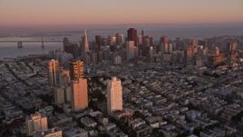 5K aerial stock footage tilt from Russian Hill apartment buildings to reveal Downtown San Francisco, California, twilight Aerial Stock Footage | AXSF10_057