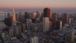 5K aerial stock footage tilt from apartment buildings to reveal Downtown San Francisco skyscrapers, California, sunset Aerial Stock Footage | AXSF10_058