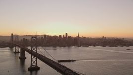 5K aerial stock footage flyby Bay Bridge with a view of Downtown San Francisco, California, twilight Aerial Stock Footage | AXSF10_066