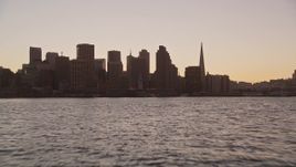 5K aerial stock footage low altitude approach to Ferry Building and Downtown San Francisco skyline, California, twilight Aerial Stock Footage | AXSF10_068