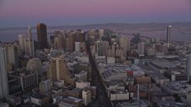 5K aerial stock footage of flying over Market Street through Downtown San Francisco, California, twilight Aerial Stock Footage | AXSF10_075