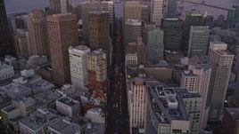 5K aerial stock footage tilt from Market Street revealing Downtown San Francisco skyscrapers, California, twilight Aerial Stock Footage | AXSF10_077