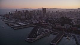 5K aerial stock footage fly away from piers, Coit Tower, and Downtown San Francisco, California, twilight Aerial Stock Footage | AXSF10_080